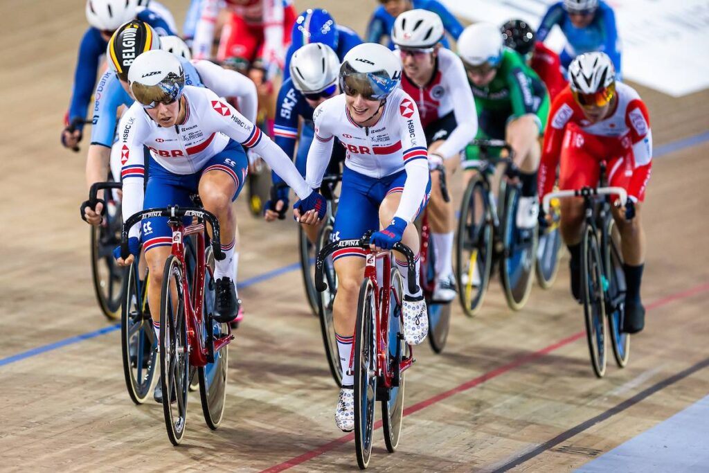 A picture of the British cycling team and other cyclers in background.