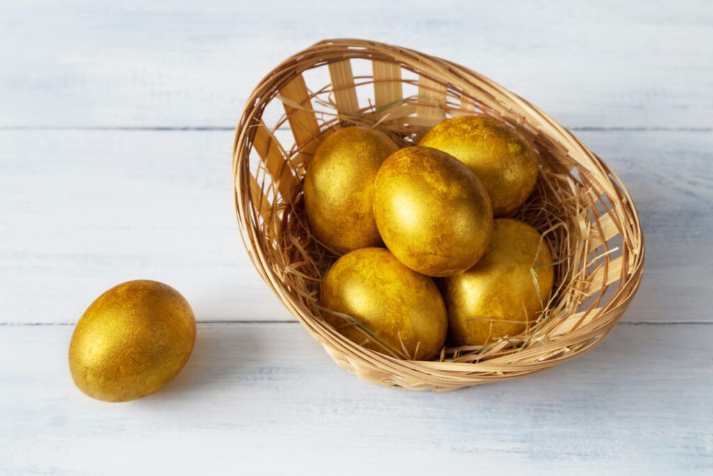 Image of golden eggs in basket.
